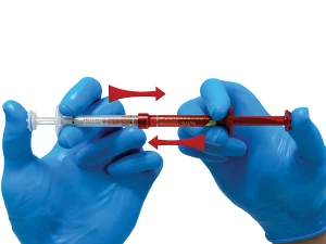 Press the contents of the clear syringe back into the red syringe. Thoroughly and rapidly mix the contents by pushing back and forth continually a minimum of 50 times (25 times each side).